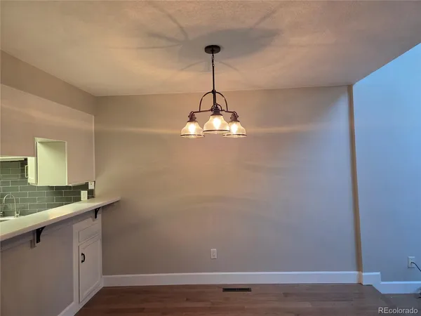 a room with a sink and a mirror