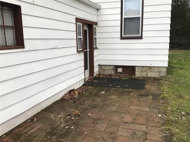a view of house with backyard of house