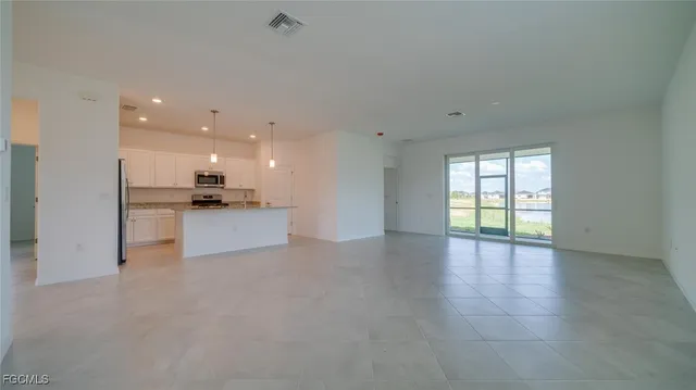 a view of a kitchen with a sink and a stove top oven