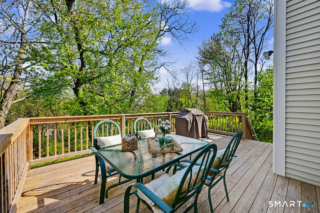 370 Nepas Road Fairfield, CT 06825 - Photo 15 of 32 a balcony with wooden floor table and chairs