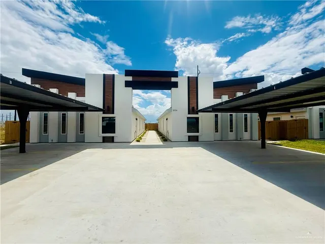 a view of a building with a flat tv screen and a fireplace