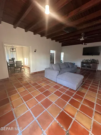 a lobby with a black countertop coffee table and chairs