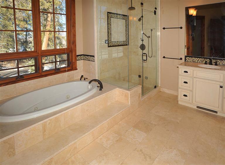 50 Elk Spring Court Edwards, CO 81632 - Photo 11 of 25 a spacious bathroom with a bathtub and a large window