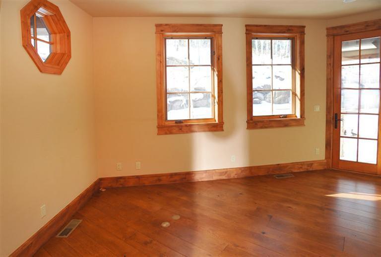 50 Elk Spring Court Edwards, CO 81632 - Photo 12 of 25 an empty room with wooden floor and windows