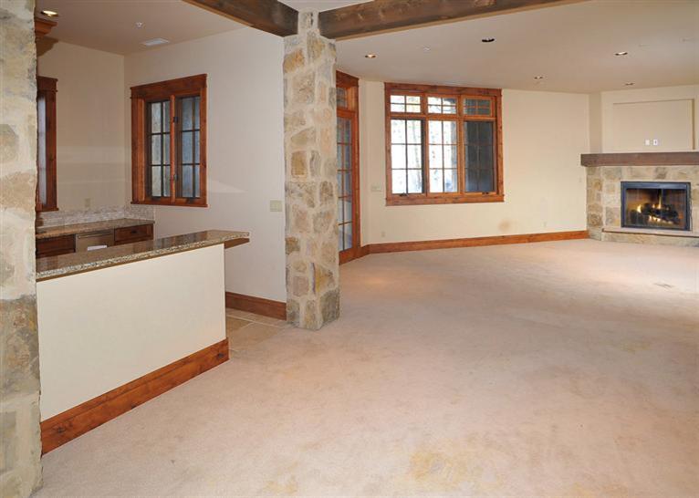 50 Elk Spring Court Edwards, CO 81632 - Photo 18 of 25 an empty room with windows and fireplace