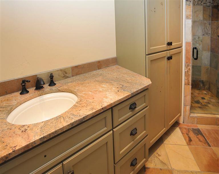 50 Elk Spring Court Edwards, CO 81632 - Photo 22 of 25 a bathroom with a granite countertop sink and a mirror