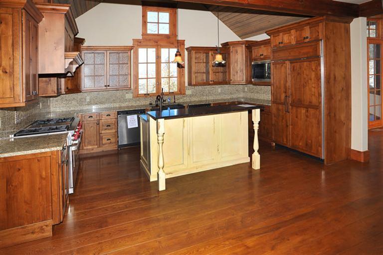 50 Elk Spring Court Edwards, CO 81632 - Photo 9 of 25 a kitchen with stainless steel appliances granite countertop a stove and a wooden cabinets
