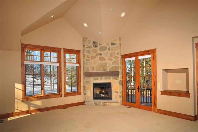 50 Elk Spring Court Edwards, CO 81632 - Photo 10 of 25 a view of an empty room with a fireplace and a window