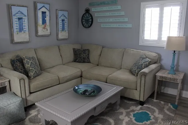 a living room with flat screen tv and a fireplace