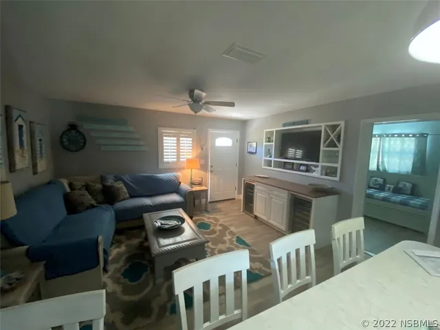 a bathroom with a granite countertop sink toilet a mirror and shower