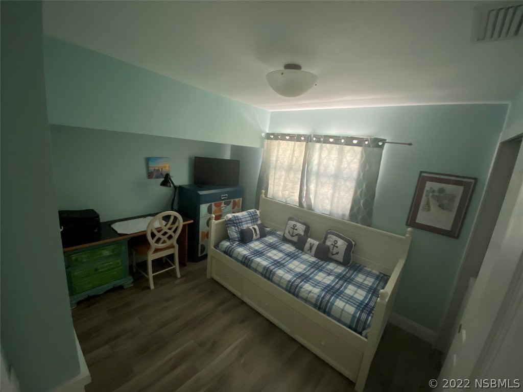 827 11th Avenue New Smyrna Beach, FL 32169 - Photo 6 of 21 a living room with furniture and a window