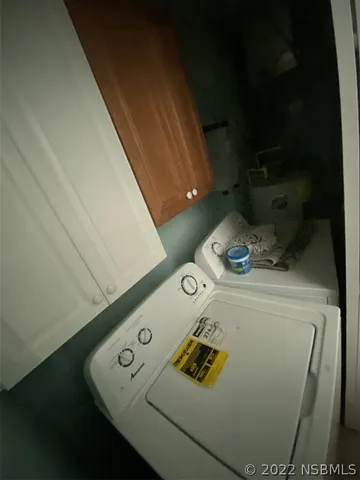 a bedroom with a bed and a chair