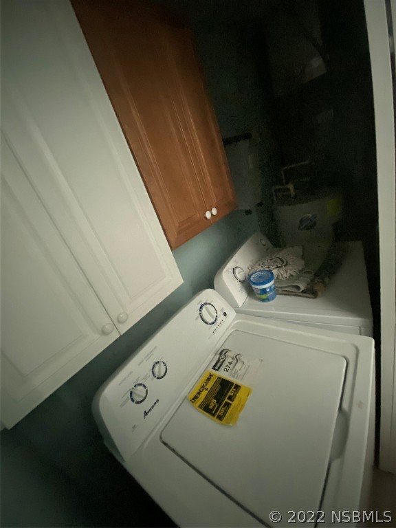 827 11th Avenue New Smyrna Beach, FL 32169 - Photo 7 of 21 a close up of a sink washer and dryer