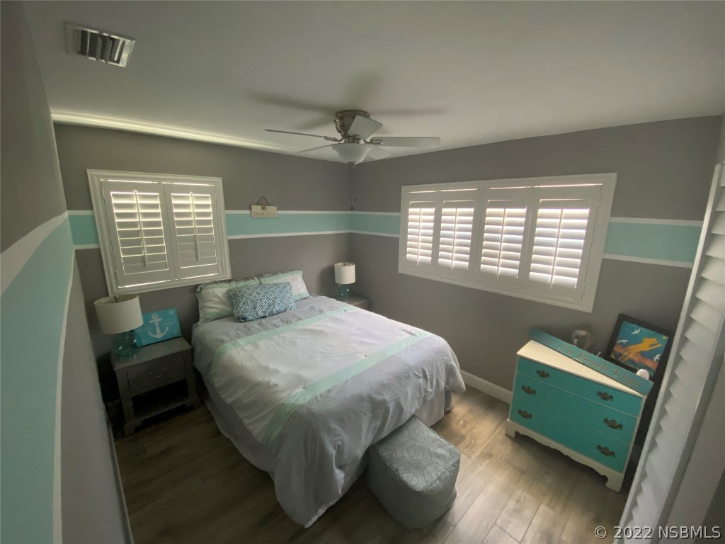 827 11th Avenue New Smyrna Beach, FL 32169 - Photo 10 of 21 a bedroom with a bed and a window