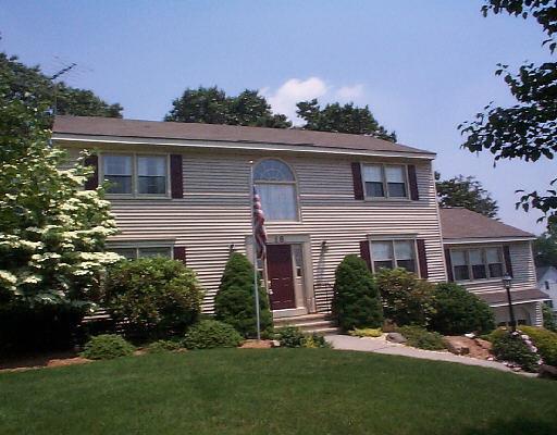 16 Wedgewood Road Trumbull, CT 06611 - Photo 1 of 1 a front view of a house with a garden