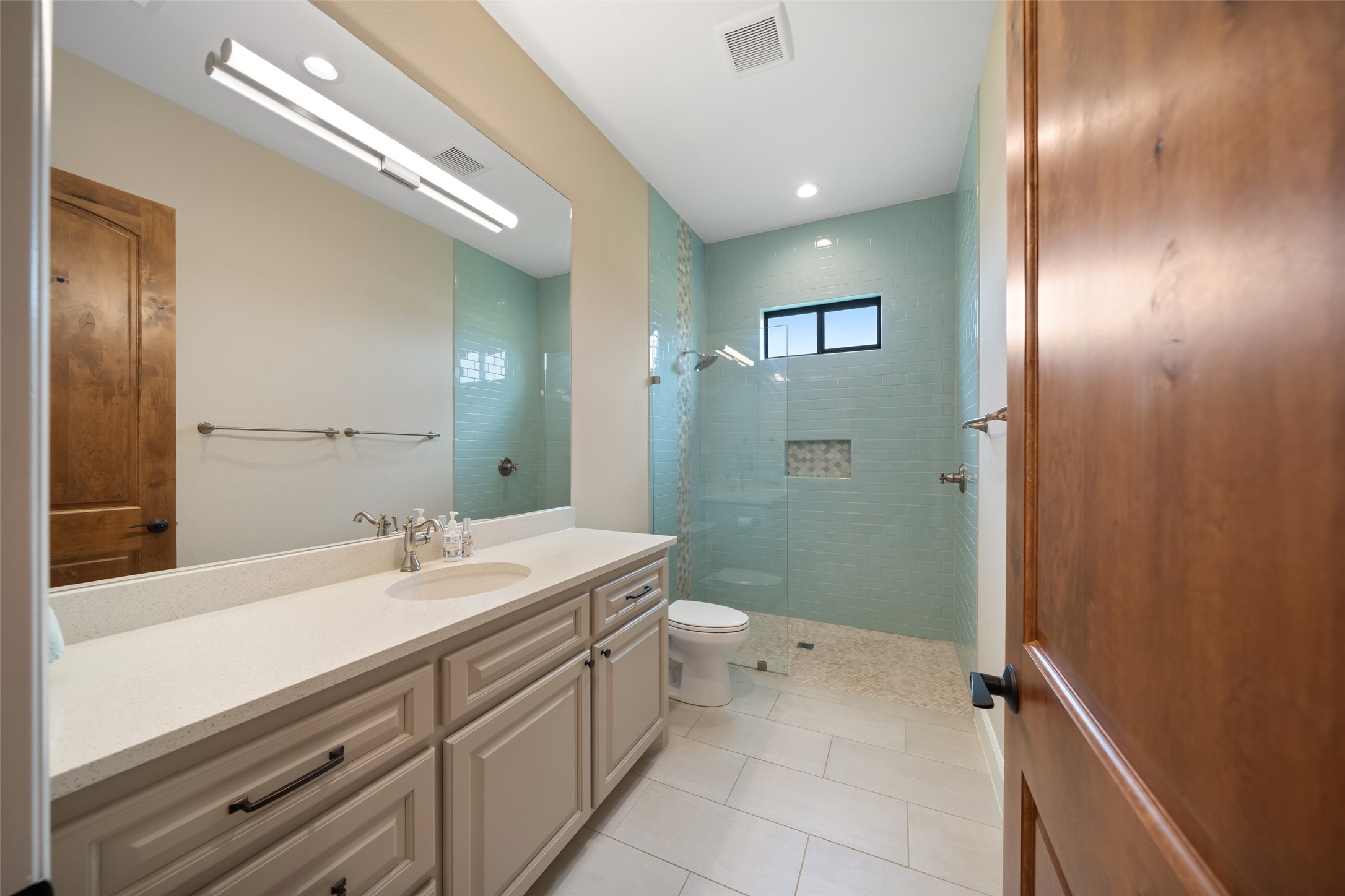 30163 High Spirit Ranch Road Hempstead, TX 77445 - Photo 29 of 49 a bathroom with a sink a toilet and shower