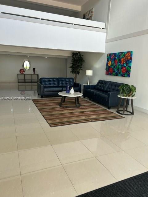 303 Racquet Club Road, Unit 106 Weston, FL 33326 - Photo 14 of 23 a living room with furniture