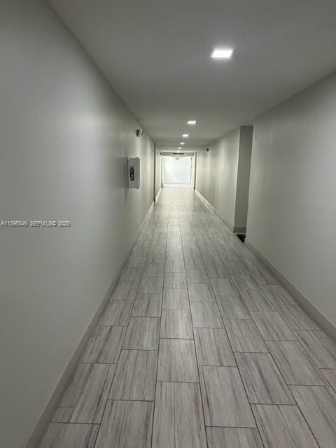 303 Racquet Club Road, Unit 106 Weston, FL 33326 - Photo 16 of 23 a view of hallway with wooden floor