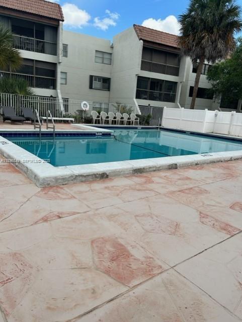303 Racquet Club Road, Unit 106 Weston, FL 33326 - Photo 18 of 23 a view of outdoor space yard deck and house