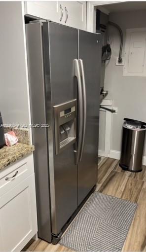 303 Racquet Club Road, Unit 106 Weston, FL 33326 - Photo 5 of 23 a refrigerator freezer sitting inside of a kitchen