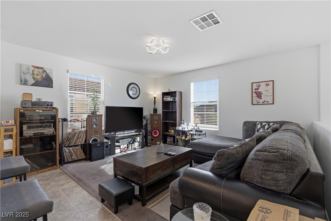 4648 Woolcomber Street Las Vegas, NV 89115 - Photo 14 of 41 Tiled living area with plenty of natural light