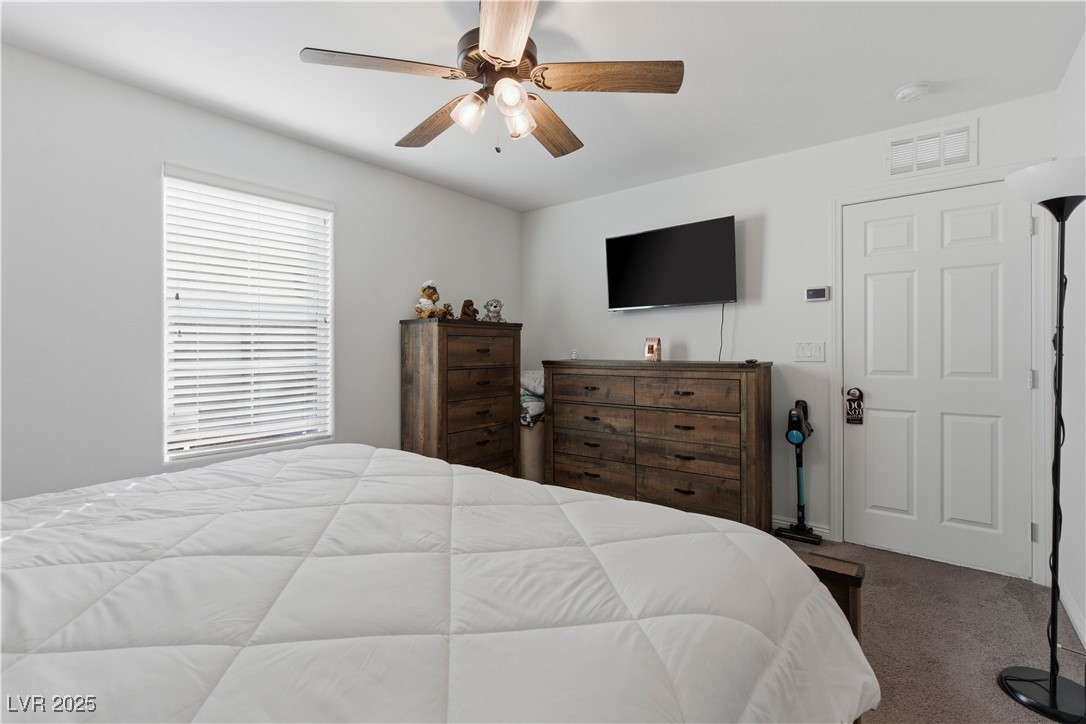4648 Woolcomber Street Las Vegas, NV 89115 - Photo 21 of 41 Carpeted bedroom with ceiling fan