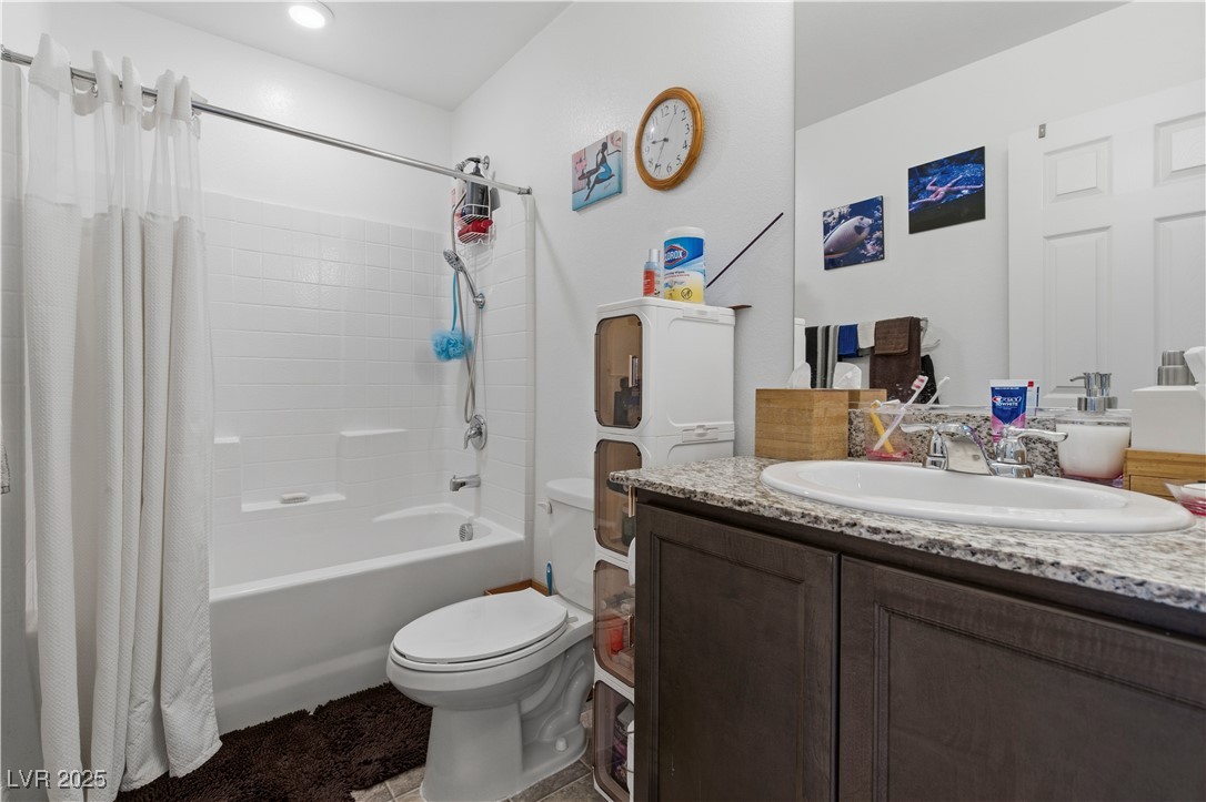 4648 Woolcomber Street Las Vegas, NV 89115 - Photo 26 of 41 Full bath featuring shower / bath combination with curtain and vanity