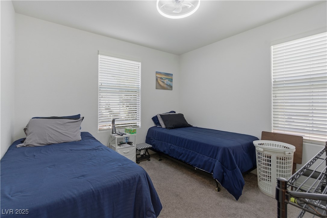 4648 Woolcomber Street Las Vegas, NV 89115 - Photo 27 of 41 Bedroom with carpet floors
