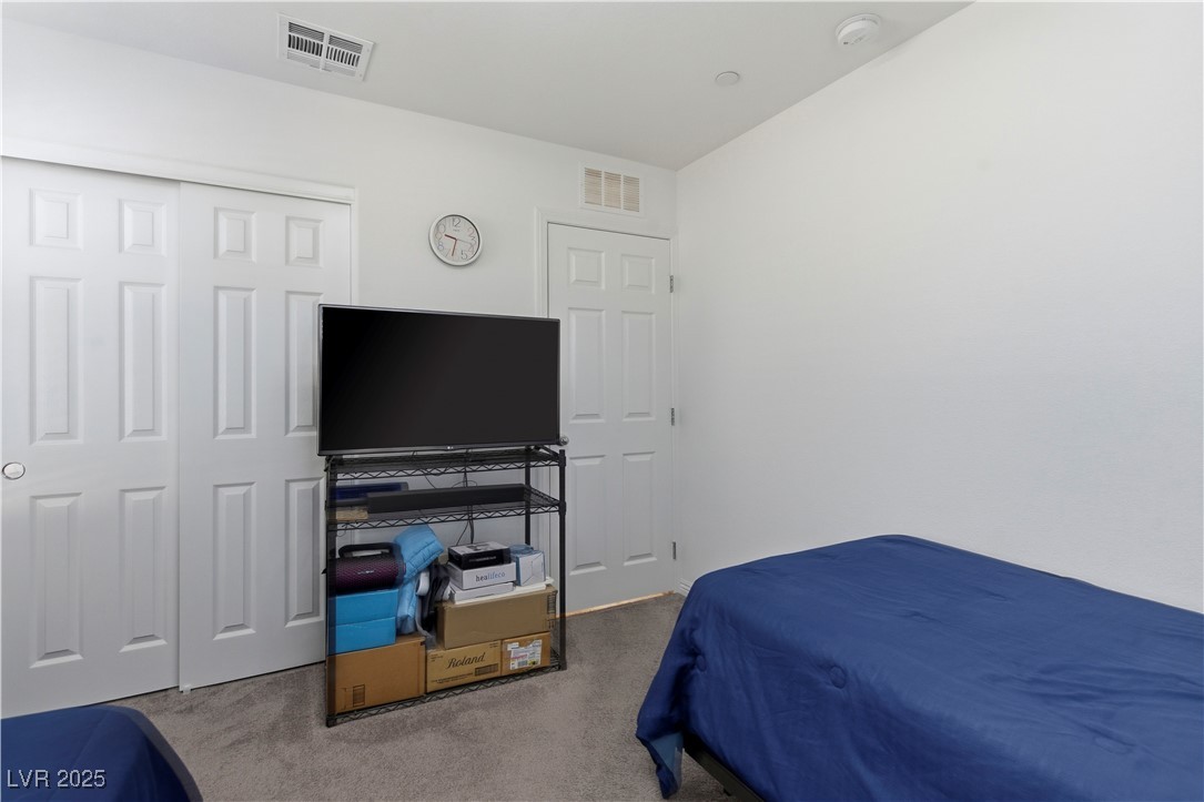 4648 Woolcomber Street Las Vegas, NV 89115 - Photo 28 of 41 Bedroom featuring carpet and a closet