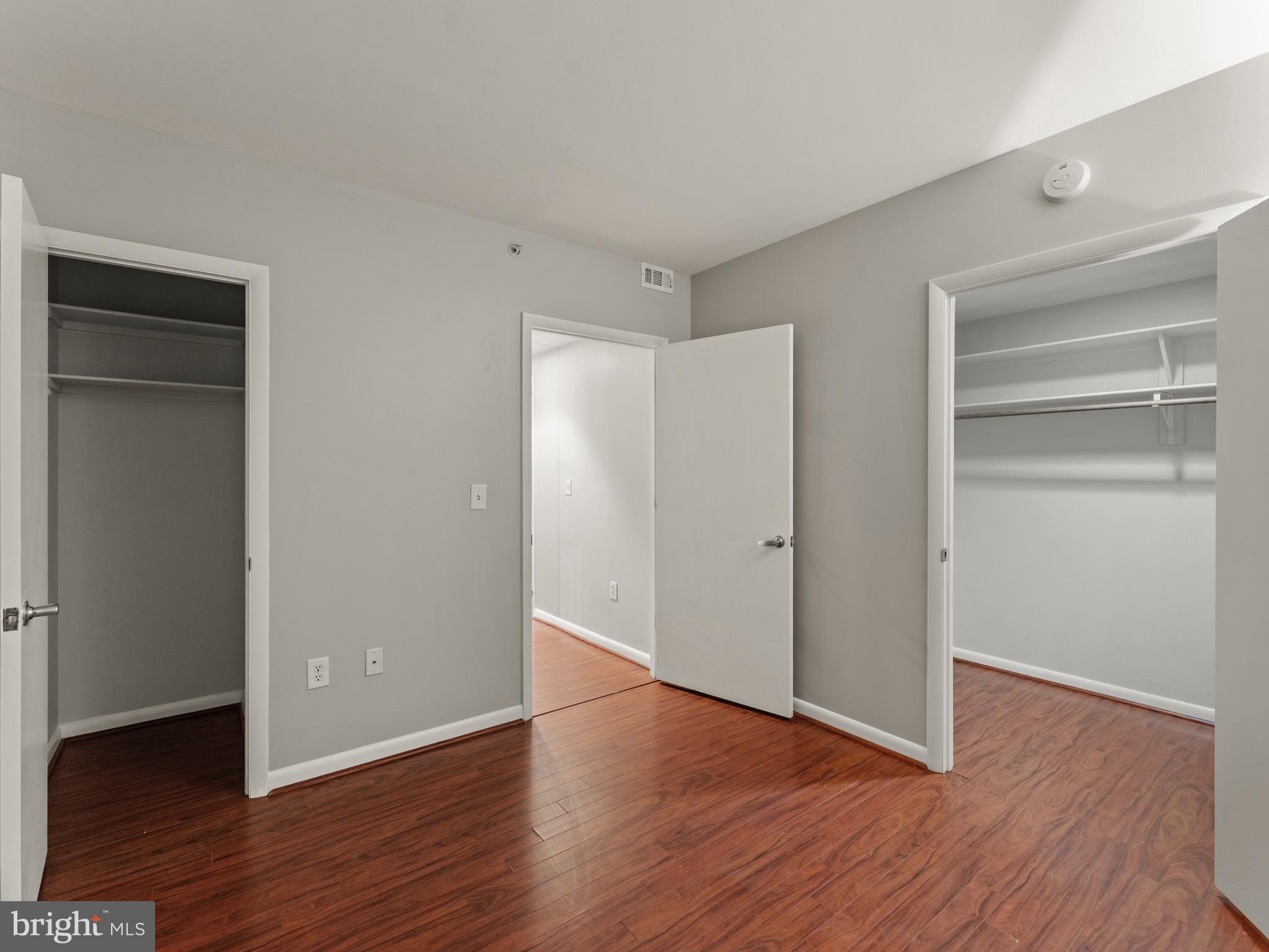 350 G Street Southwest, Unit N310 Washington, DC 20024 - Photo 21 of 26 a view of an empty room with wooden floor & closet
