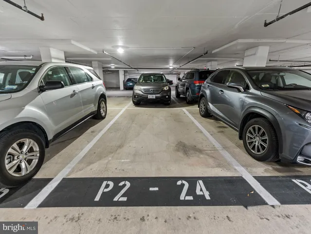 a view of parking space with a car parked