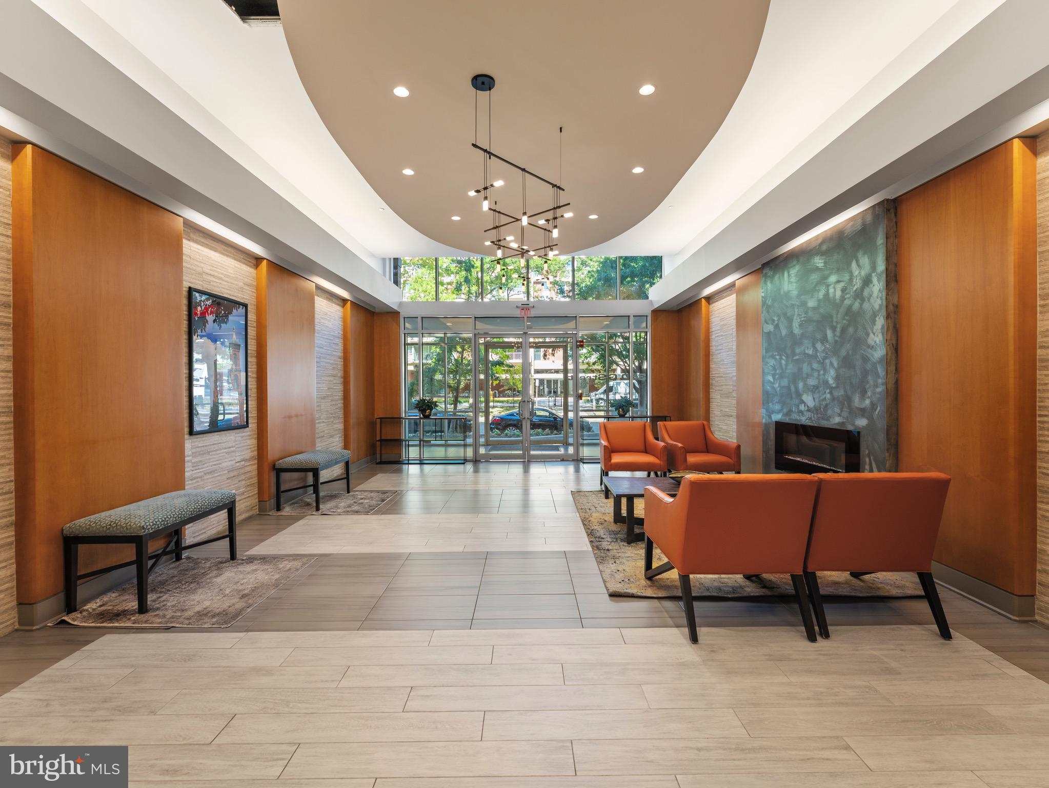 350 G Street Southwest, Unit N310 Washington, DC 20024 - Photo 24 of 26 a living room with furniture and a large window