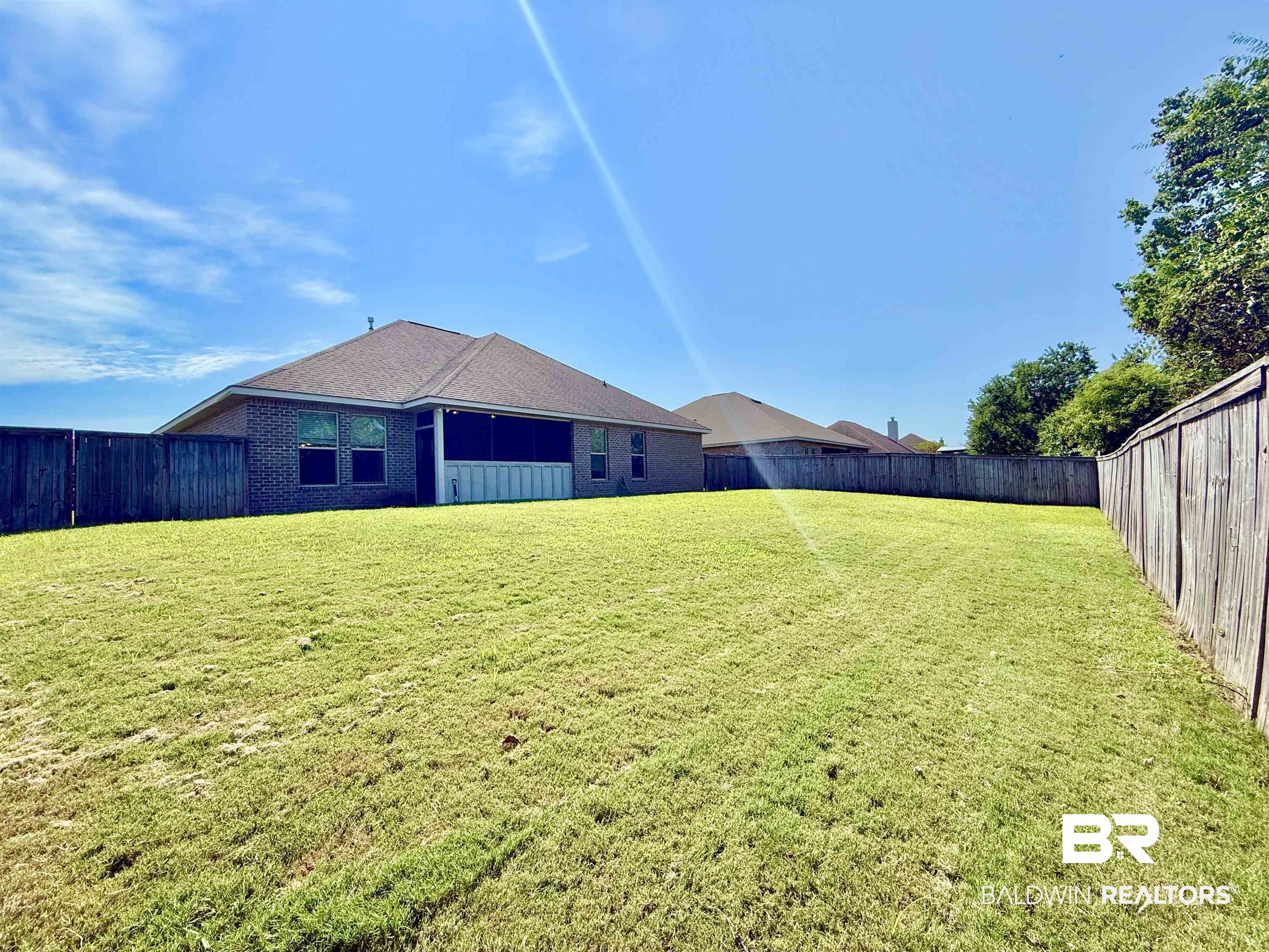 7011 Rocky Rd Loop Gulf Shores, AL 36542 - Photo 45 of 66 View of fenced backyard