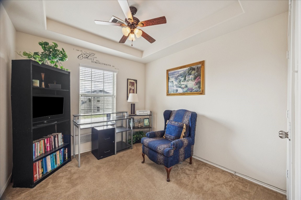12811 Rio Lindo Street Rosharon, TX 77583 - Photo 8 of 13 a living room with furniture a flat screen tv and a window