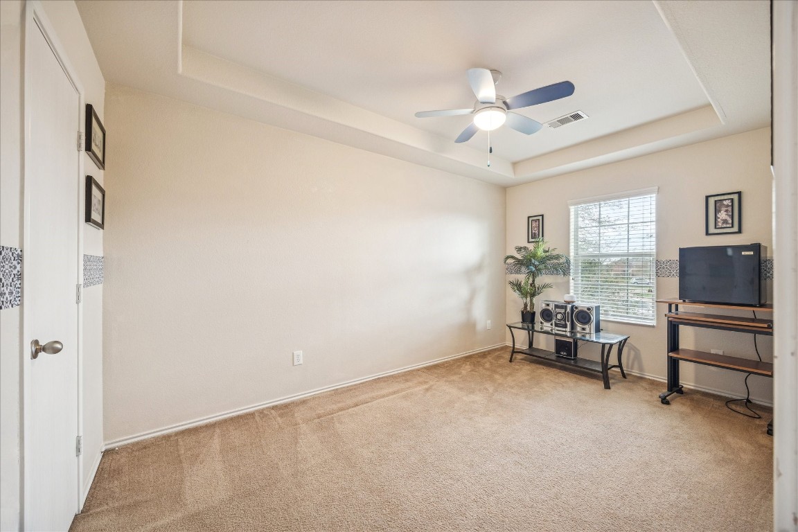 12811 Rio Lindo Street Rosharon, TX 77583 - Photo 9 of 13 a view of an empty room with a window