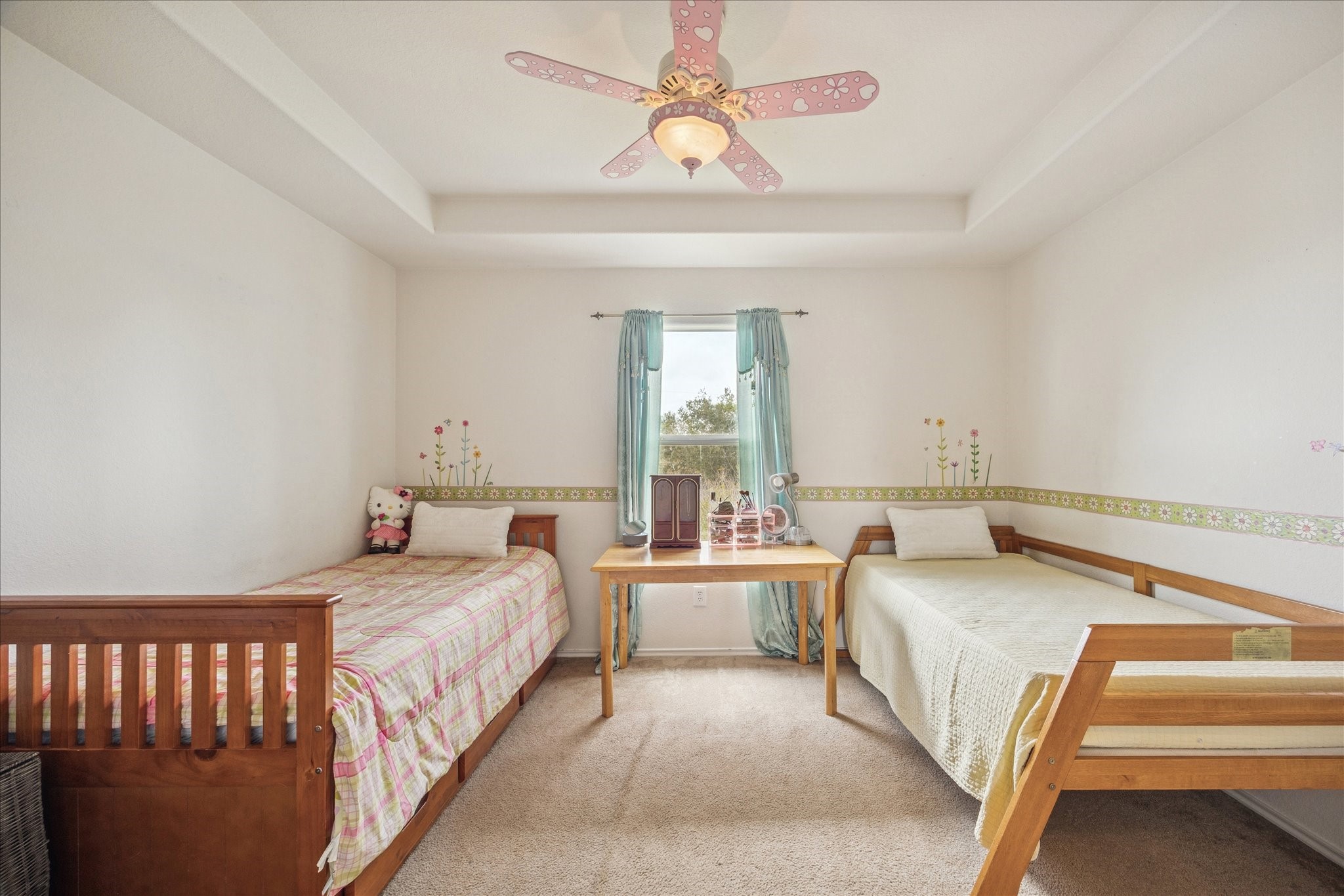 12811 Rio Lindo Street Rosharon, TX 77583 - Photo 10 of 13 a bedroom with a bed and a chandelier