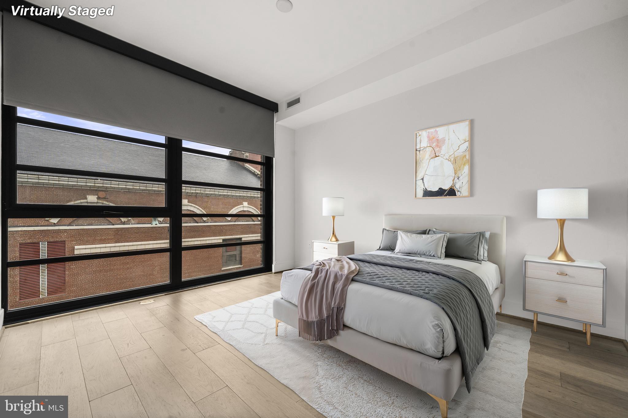 1300 4th Street Southeast, Unit 312 Washington, DC 20003 - Photo 16 of 39 a bedroom with a bed and a night stand