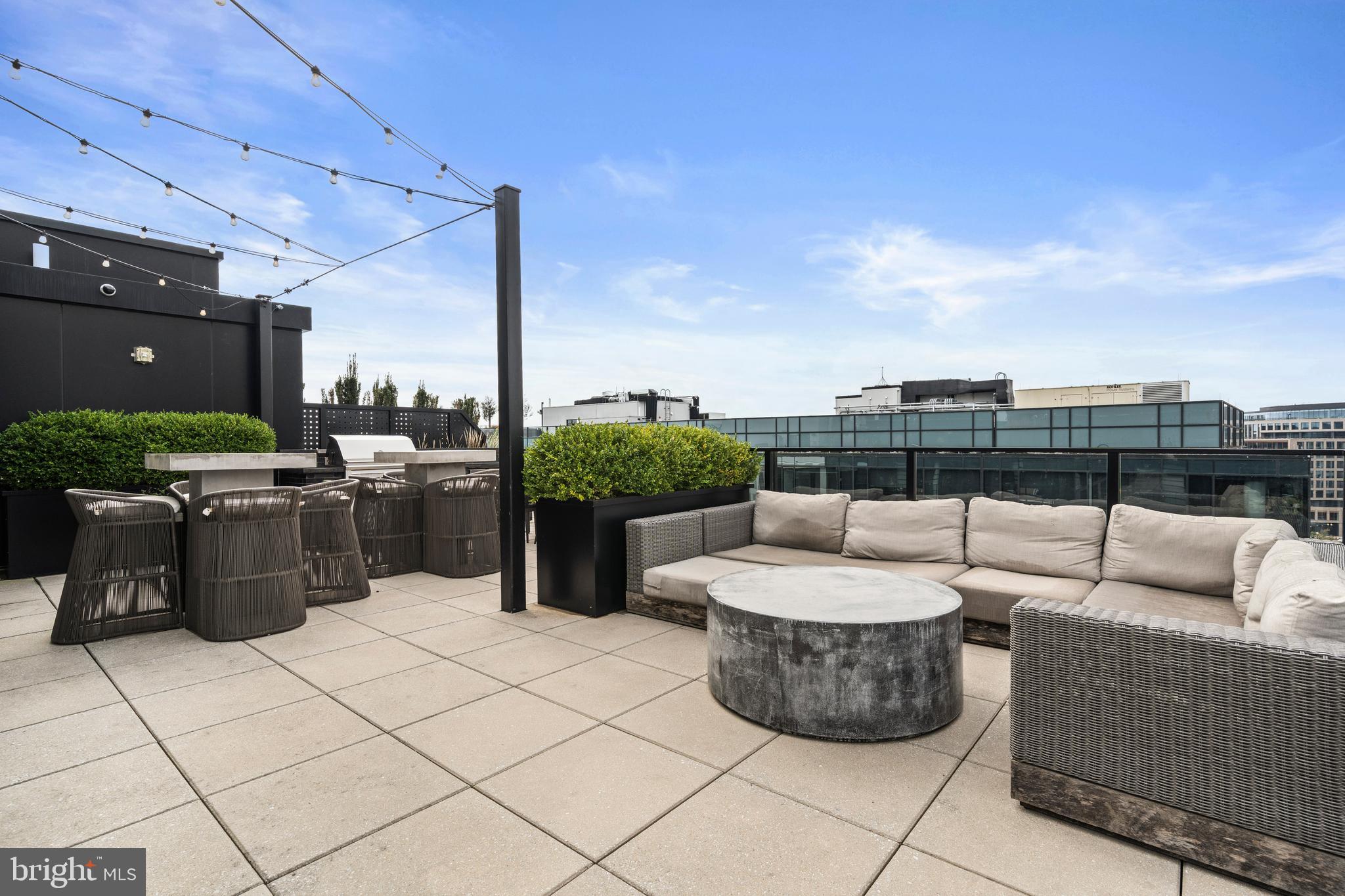 1300 4th Street Southeast, Unit 312 Washington, DC 20003 - Photo 35 of 39 a view of a patio with couches and chairs