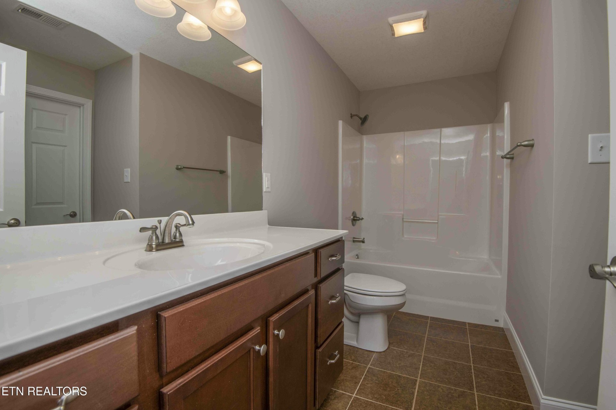 337 Angus Crossing Corryton, TN 37721 - Photo 18 of 36 a bathroom with a sink a toilet and shower