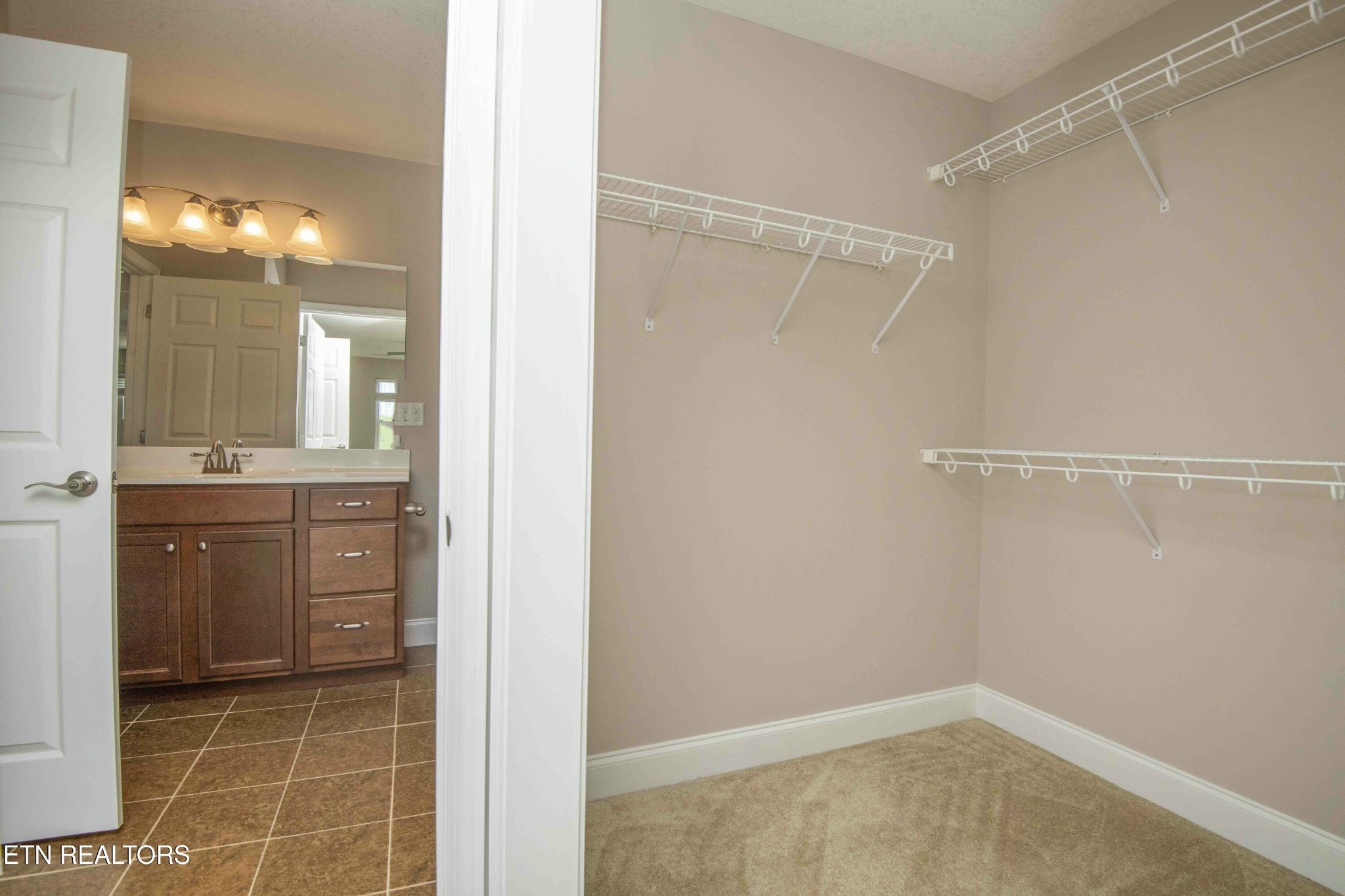 337 Angus Crossing Corryton, TN 37721 - Photo 19 of 36 a bathroom with a shower sink and mirror