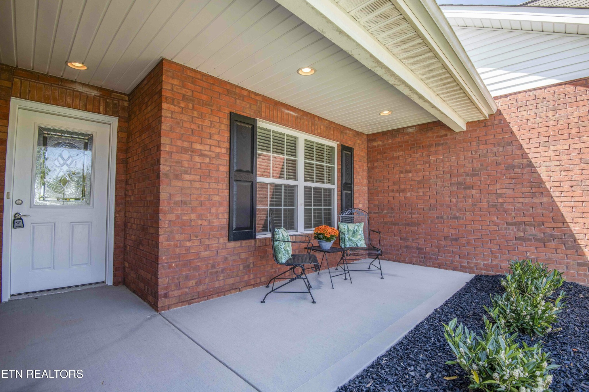 337 Angus Crossing Corryton, TN 37721 - Photo 3 of 36 a patio with table and chairs and potted plants