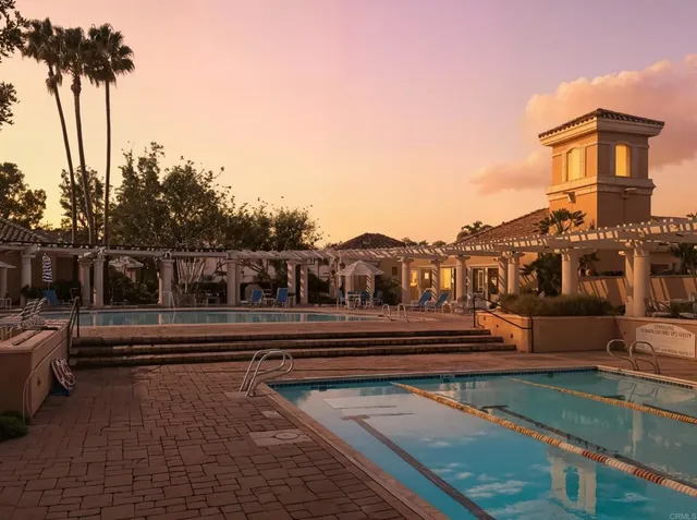 a kitchen with stainless steel appliances a stove a sink and a microwave