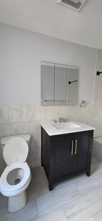 a bathroom with a sink and a toilet