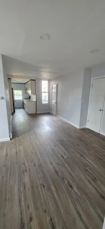 a view of a livingroom with wooden floor