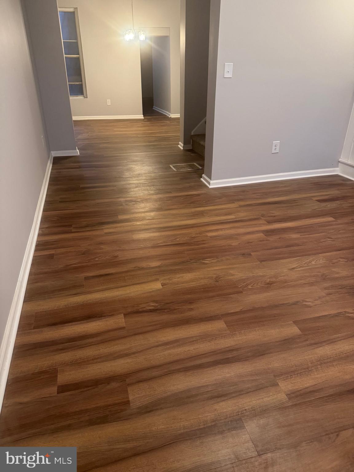 2732 Riggs Avenue Baltimore, MD 21216 - Photo 19 of 23 a view of an empty room with wooden floor