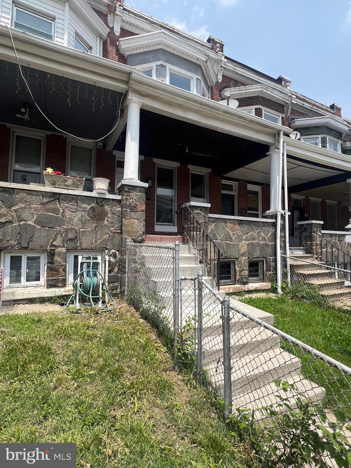 2732 Riggs Avenue Baltimore, MD 21216 - Photo 2 of 23 front view of a building with a garden