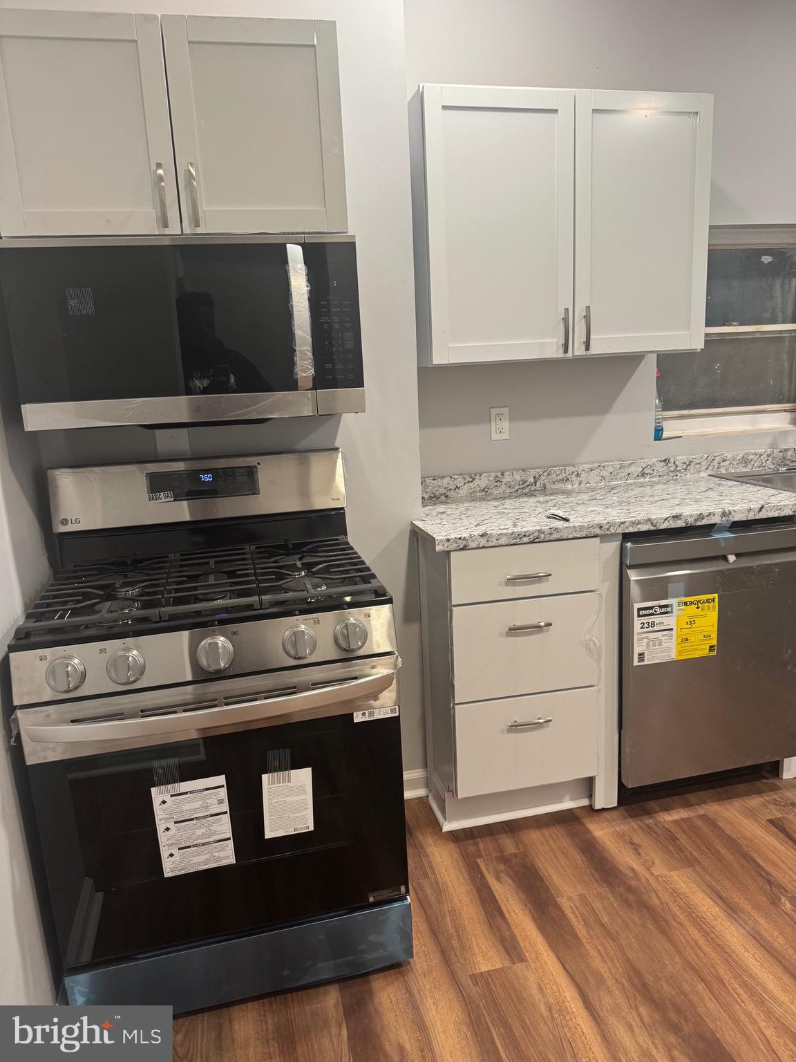 2732 Riggs Avenue Baltimore, MD 21216 - Photo 9 of 23 a stove top oven sitting inside of a kitchen
