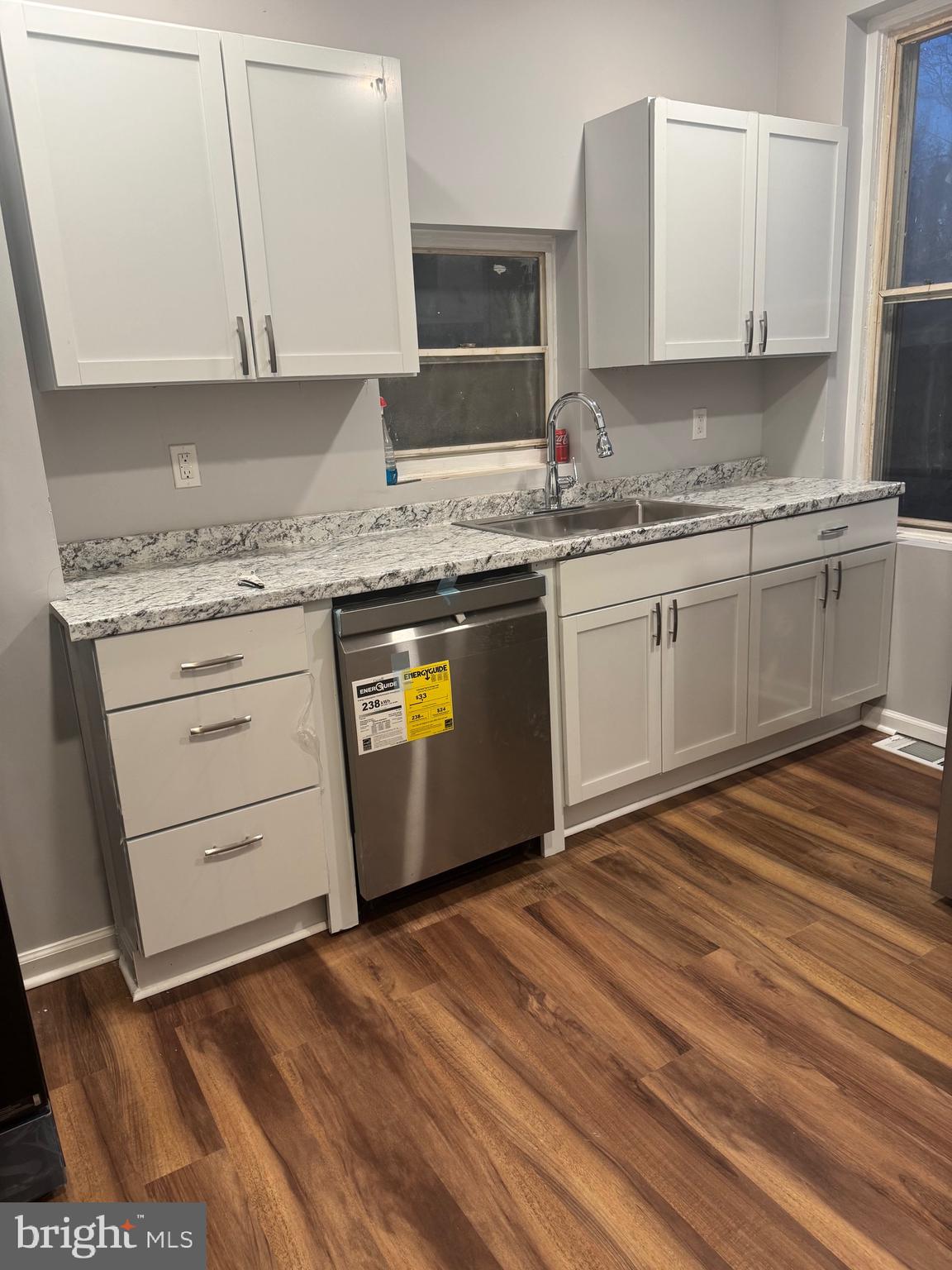 2732 Riggs Avenue Baltimore, MD 21216 - Photo 10 of 23 a kitchen with granite countertop a sink cabinets and stainless steel appliances