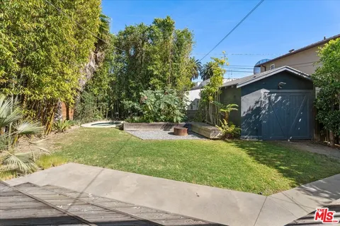 a view of backyard with tree