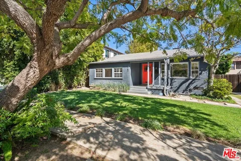 a house view with a sitting space and garden